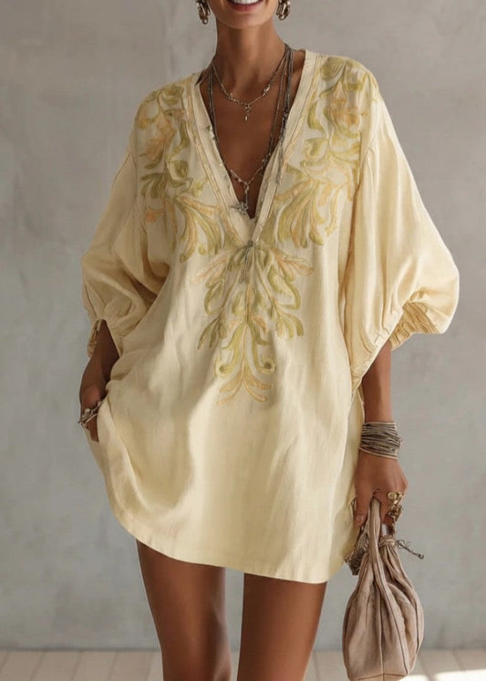 Robe jaune à manches lanternes et broderie