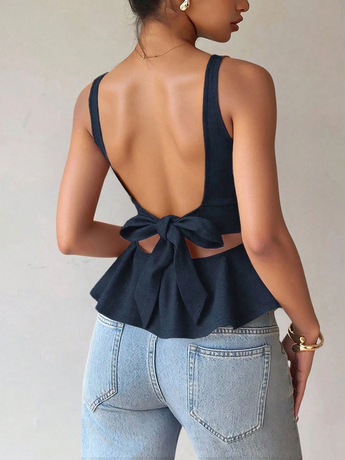 Sleeveless Ruffled Hem Bow Tie Back Blouse